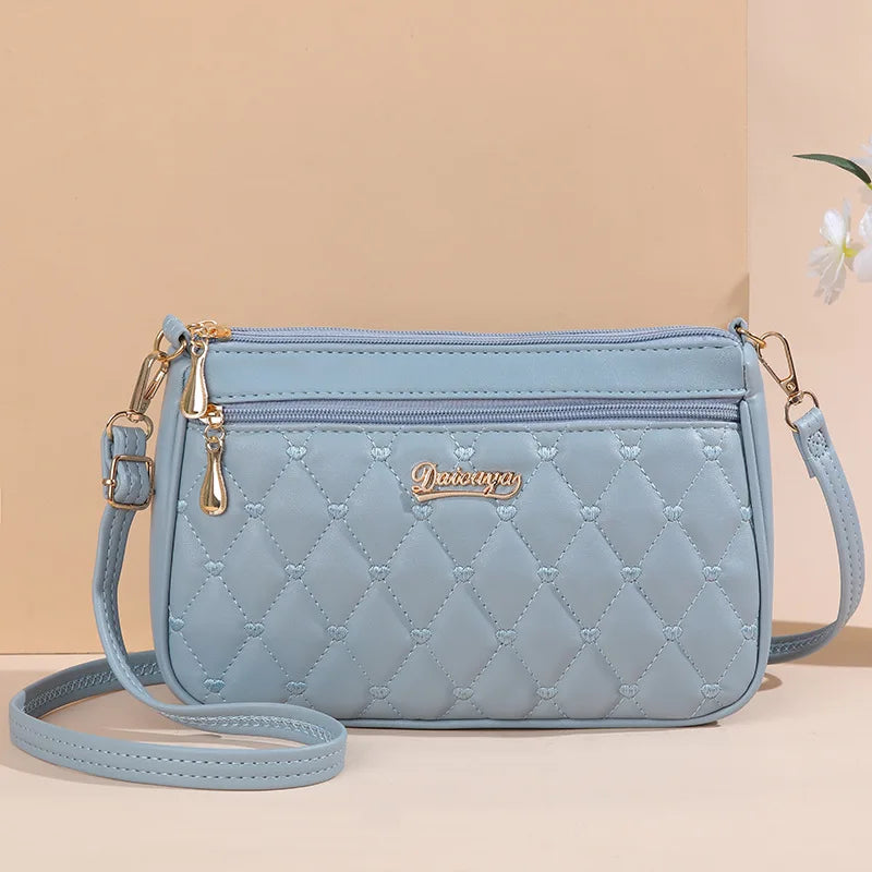 Lily™ - Bolsa Messenger Bordada