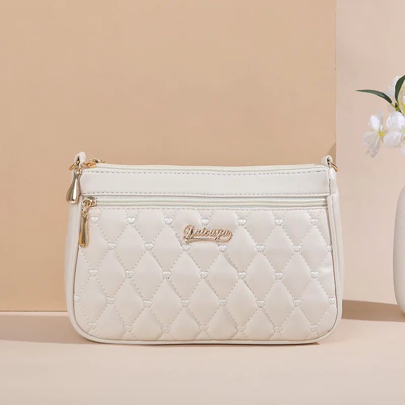 Lily™ - Bolsa Messenger Bordada